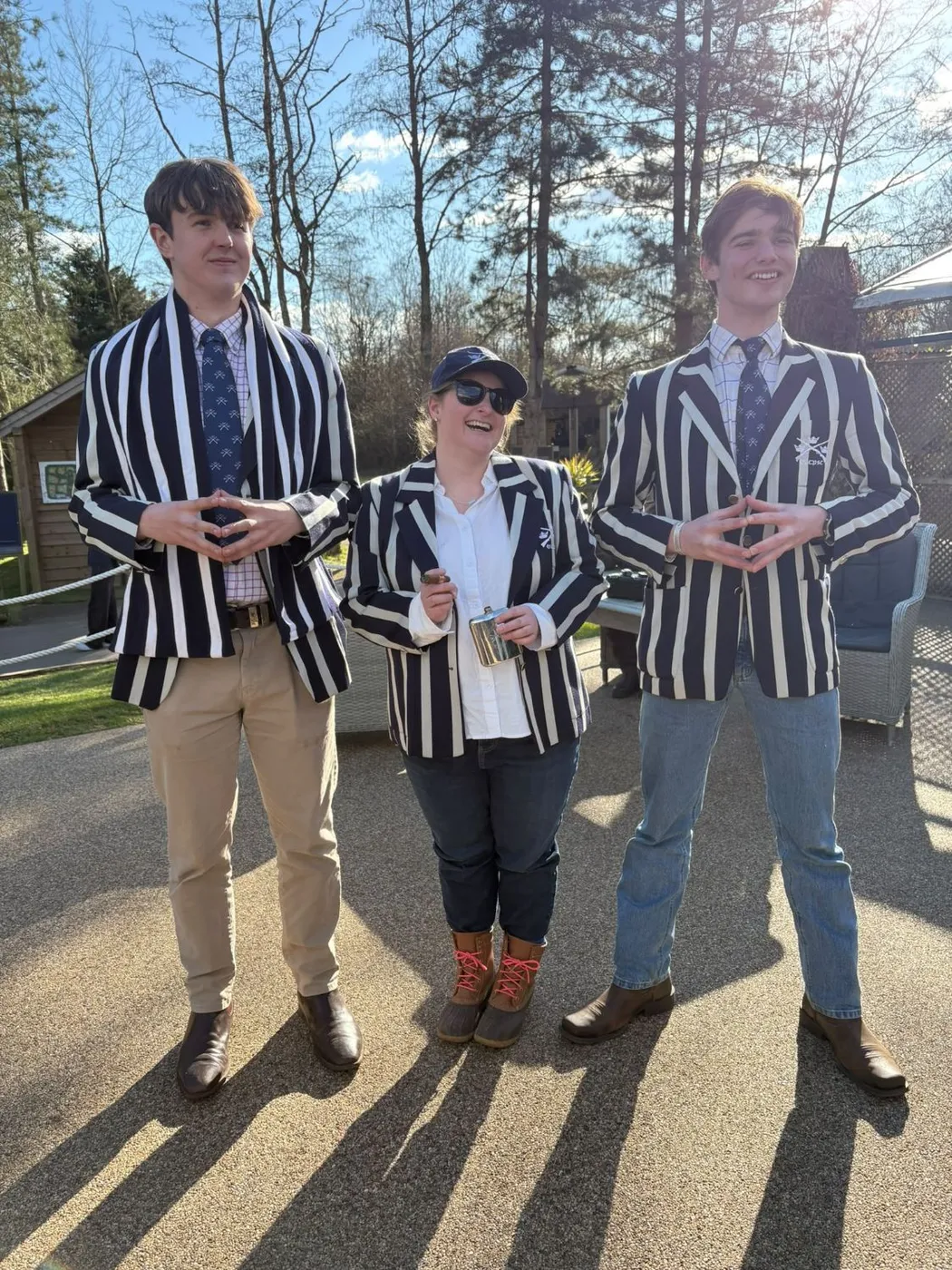 Three members in striped club blazers